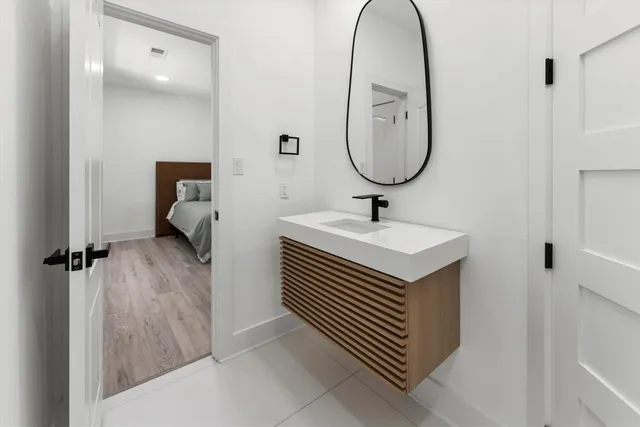 a bathroom with a sink and a mirror