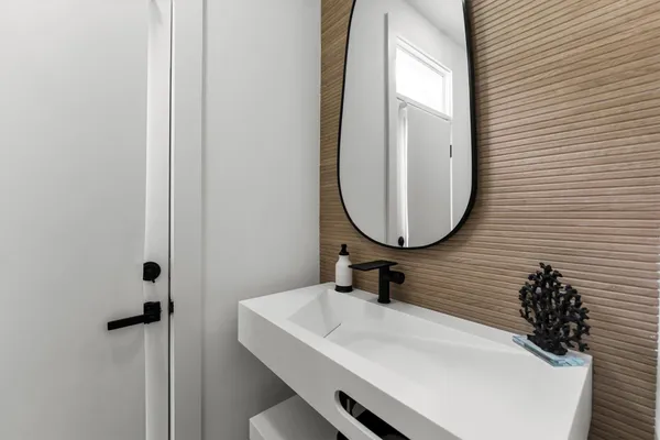 a bathroom with a sink and a mirror