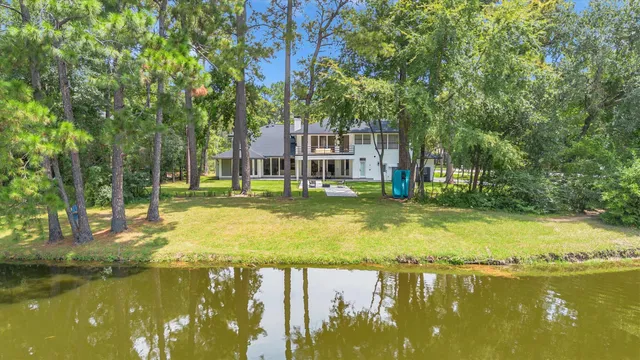 a swimming pool with outdoor seating and yard