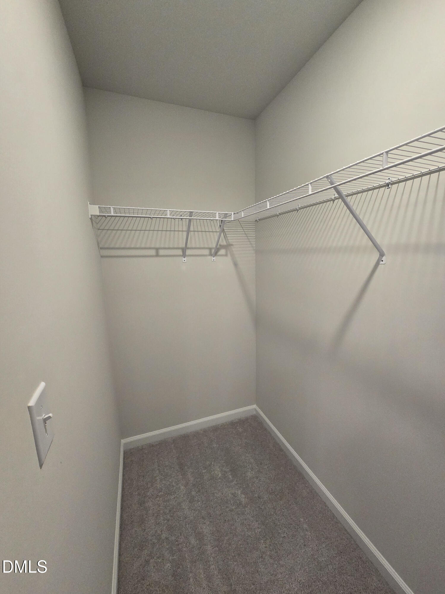 2431 Kasota Lane Raleigh, NC 27610 - Photo 33 of 46 a view of a room with racks on the wall