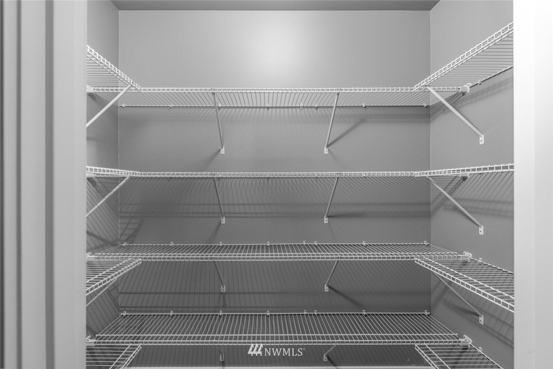 10503 Angeline Road East Bonney Lake, WA 98391 - Photo 12 of 38 a view of a room with racks on the wall