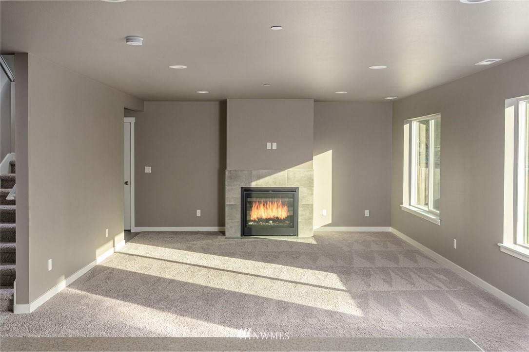 10503 Angeline Road East Bonney Lake, WA 98391 - Photo 13 of 38 a view of a livingroom with a staircase