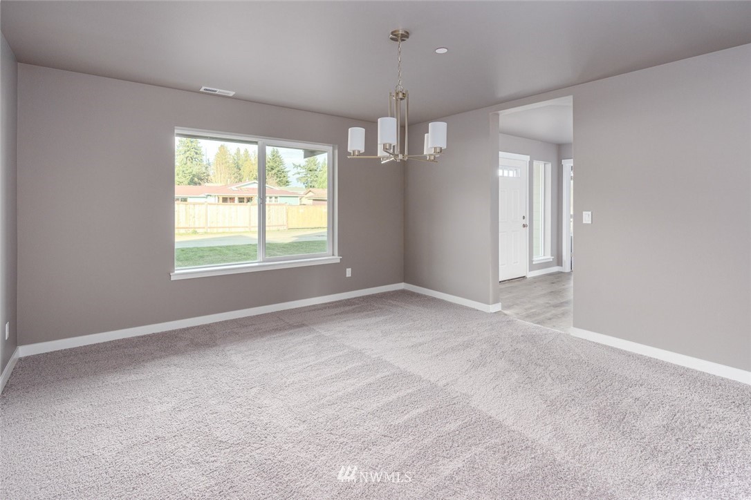 10503 Angeline Road East Bonney Lake, WA 98391 - Photo 16 of 38 a view of an empty room with a window