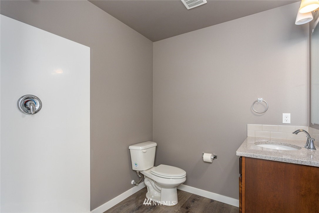 10503 Angeline Road East Bonney Lake, WA 98391 - Photo 18 of 38 a bathroom with a sink and a toilet