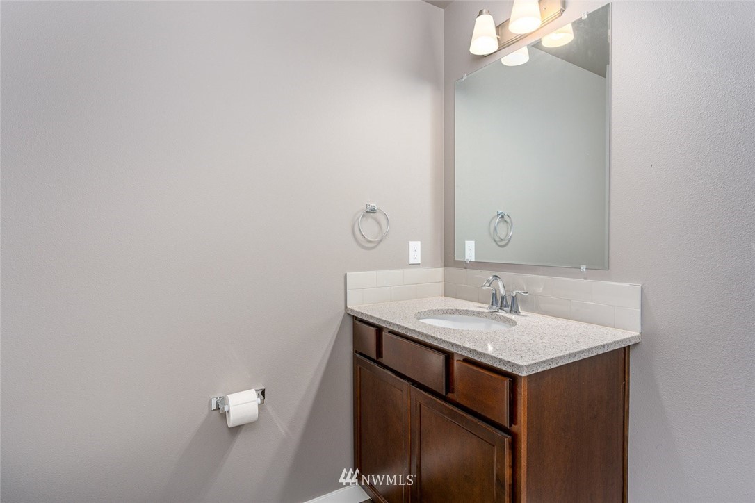 10503 Angeline Road East Bonney Lake, WA 98391 - Photo 19 of 38 a bathroom with a sink and a mirror