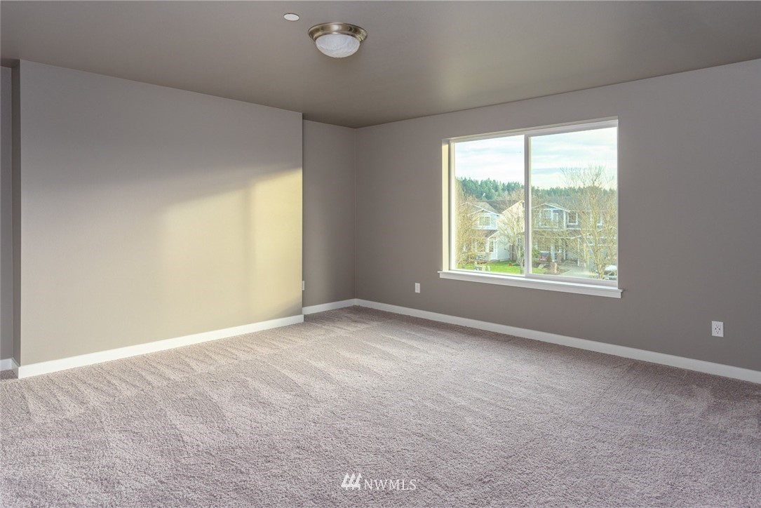 10503 Angeline Road East Bonney Lake, WA 98391 - Photo 21 of 38 an empty room with a window