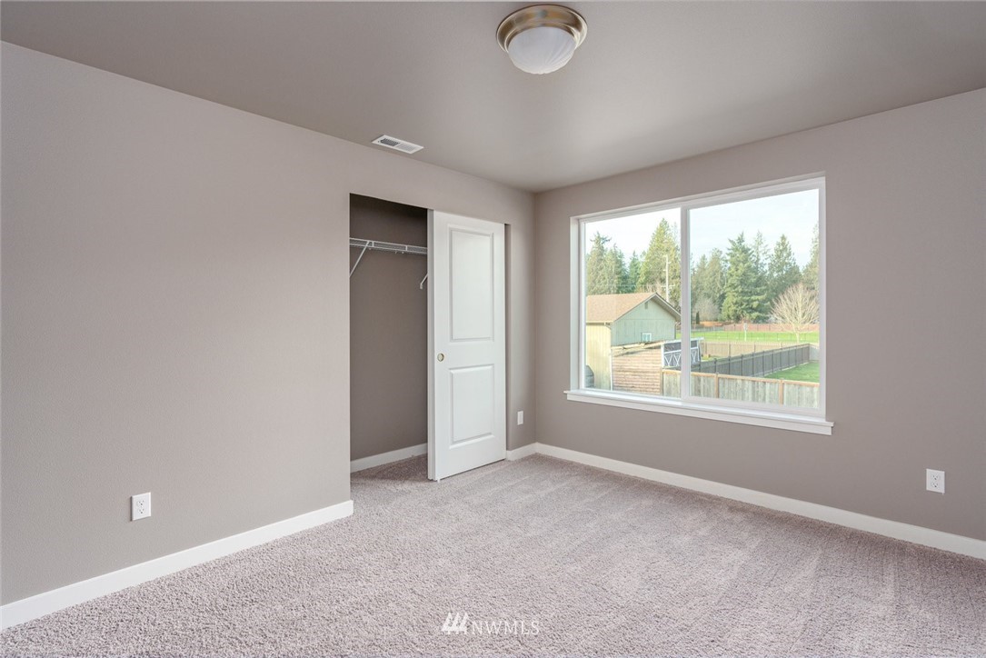 10503 Angeline Road East Bonney Lake, WA 98391 - Photo 26 of 38 a view of an empty room with a window