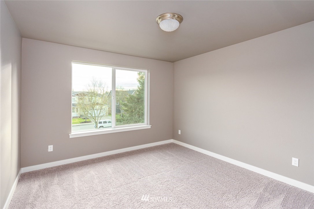10503 Angeline Road East Bonney Lake, WA 98391 - Photo 28 of 38 an empty room with a window