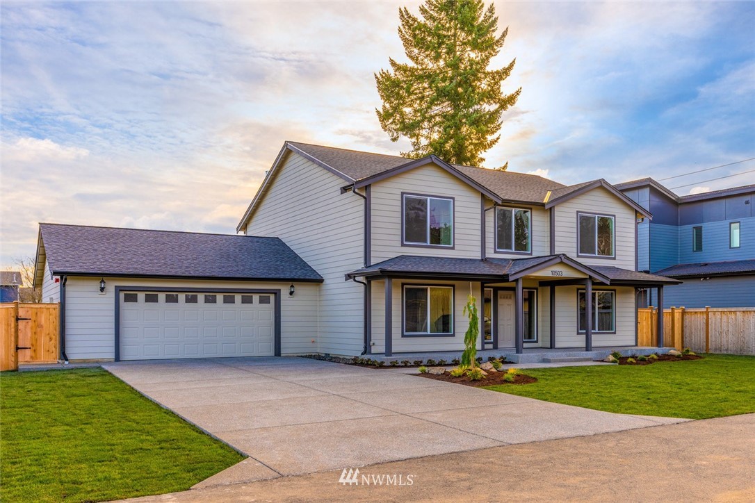 10503 Angeline Road East Bonney Lake, WA 98391 - Photo 3 of 38 a front view of a house with a yard and garage