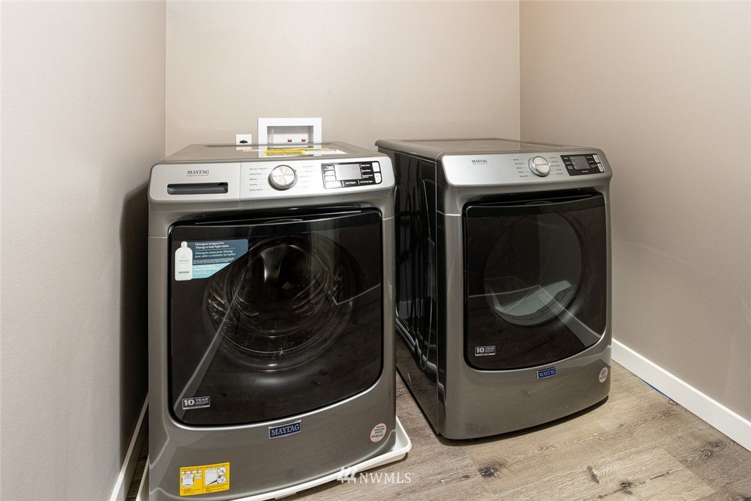 10503 Angeline Road East Bonney Lake, WA 98391 - Photo 32 of 38 a close up view of washer and dryer