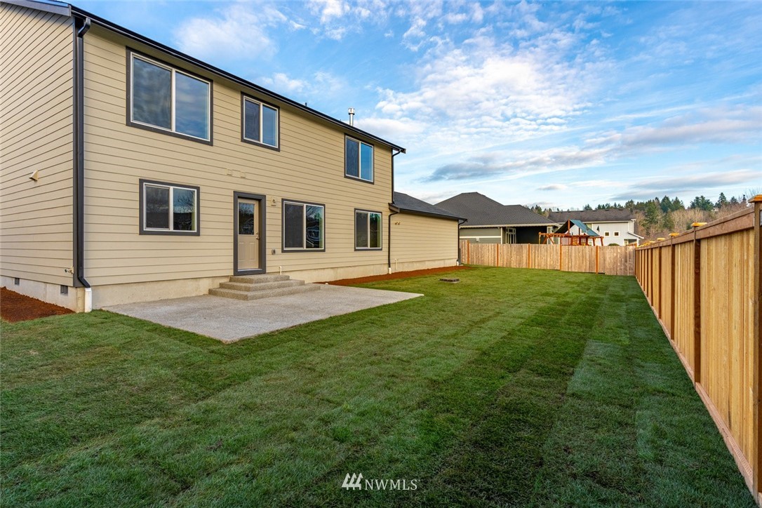 10503 Angeline Road East Bonney Lake, WA 98391 - Photo 35 of 38 a front view of a house with a yard