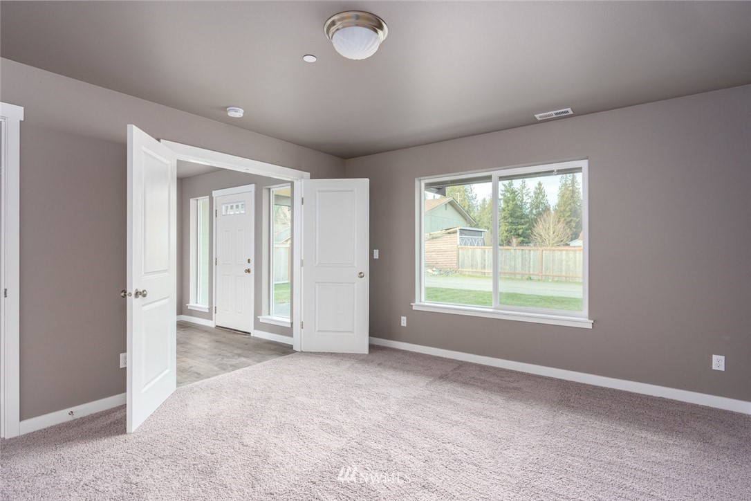 10503 Angeline Road East Bonney Lake, WA 98391 - Photo 7 of 38 an empty room with windows and closet