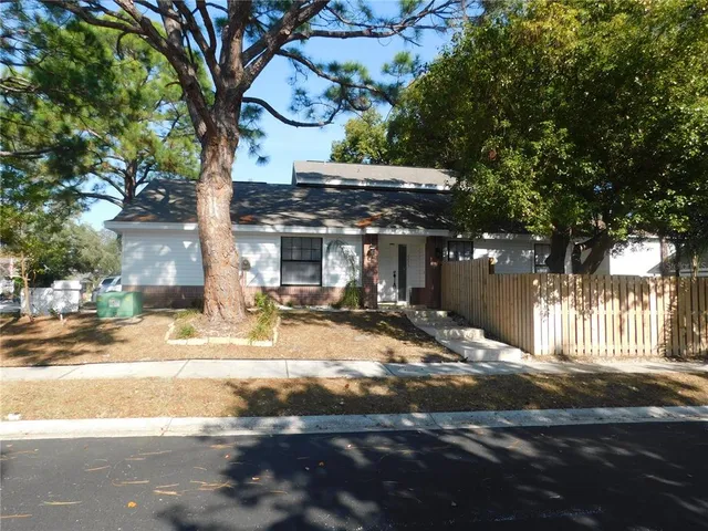 a view of a building with a tree in front of it