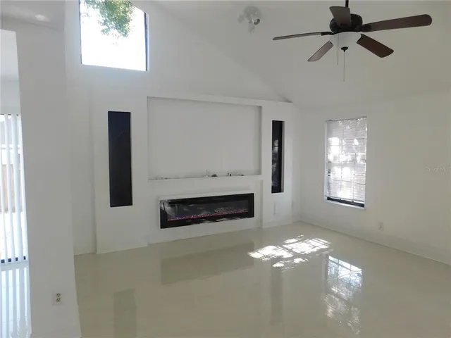 a view of kitchen with furniture and wooden floor