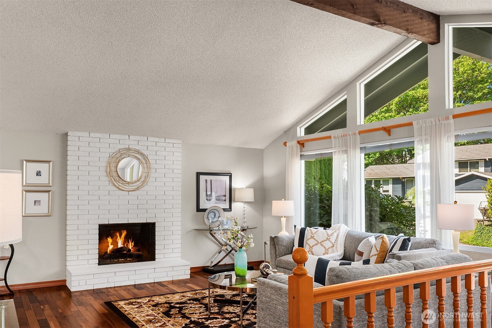 21331 2nd Avenue Southeast Bothell, WA 98021 - Photo 2 of 34 a living room with furniture a fireplace and a large window
