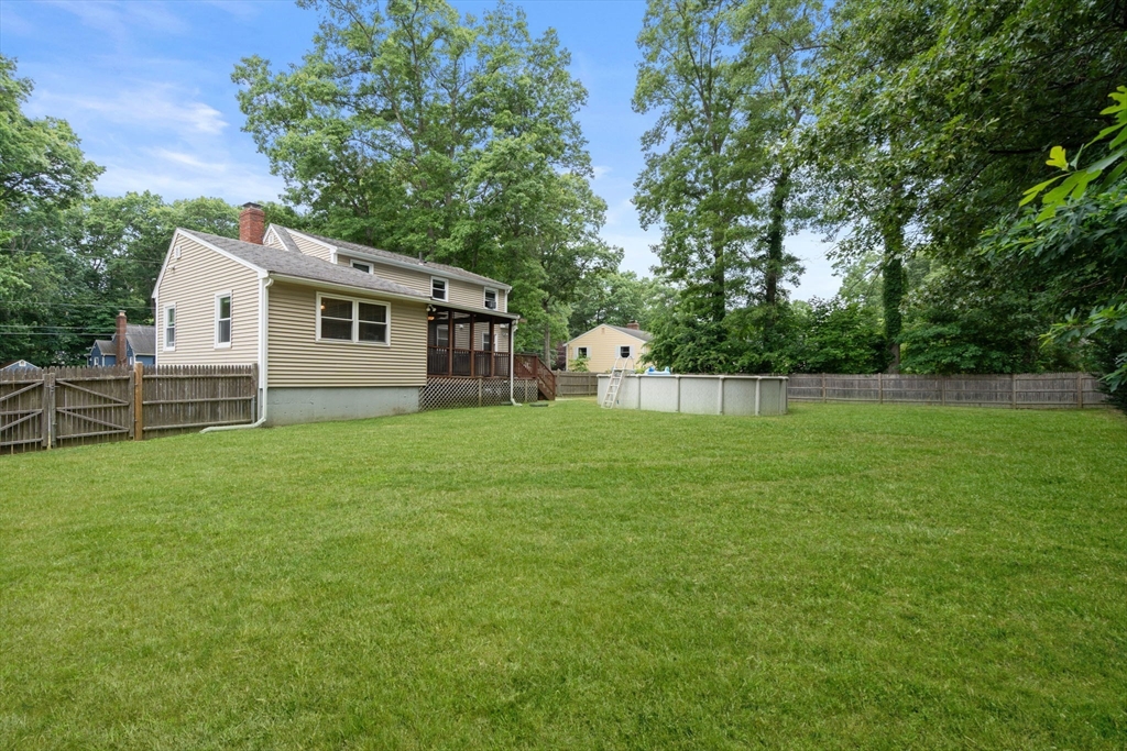 9 Laurel Lane Bellingham, MA 02019 - Photo 4 of 30 a view of a house with a backyard