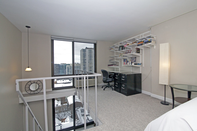 1221 North Dearborn Parkway, Unit 1601N Chicago, IL 60610 - Photo 11 of 21 a bedroom with furniture and a window