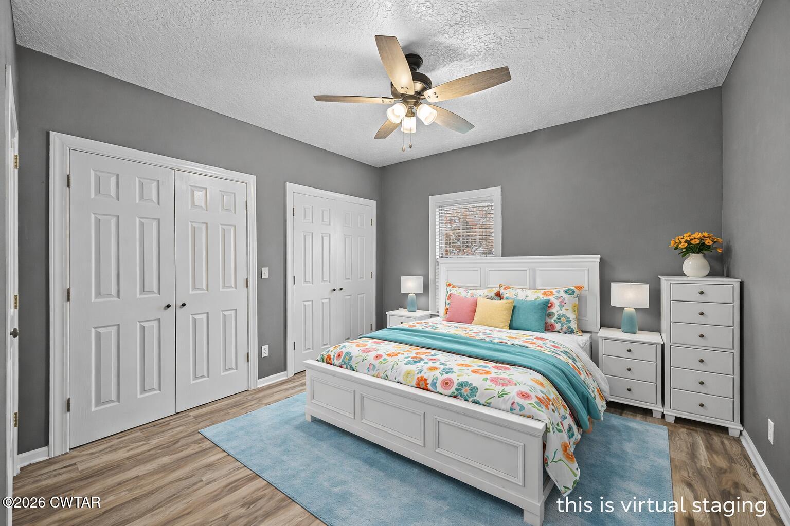 31 Turkey Creek Road Medina, TN 38355 - Photo 21 of 30 a bedroom with a bed and a chandelier