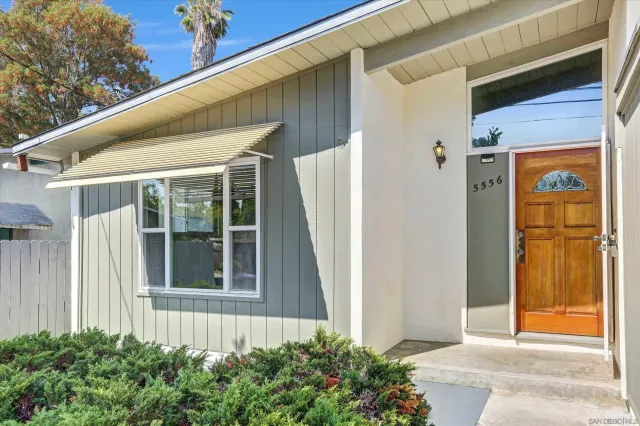 a front view of a house with a garage