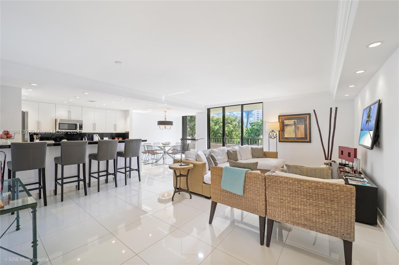 Key Biscayne Key Biscayne, FL 33149 - Photo 2 of 12 a living room with furniture and a flat screen tv