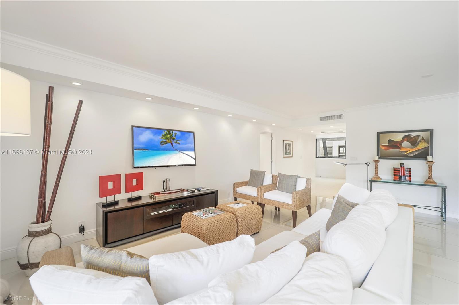 Key Biscayne Key Biscayne, FL 33149 - Photo 3 of 12 a living room with furniture and a flat screen tv