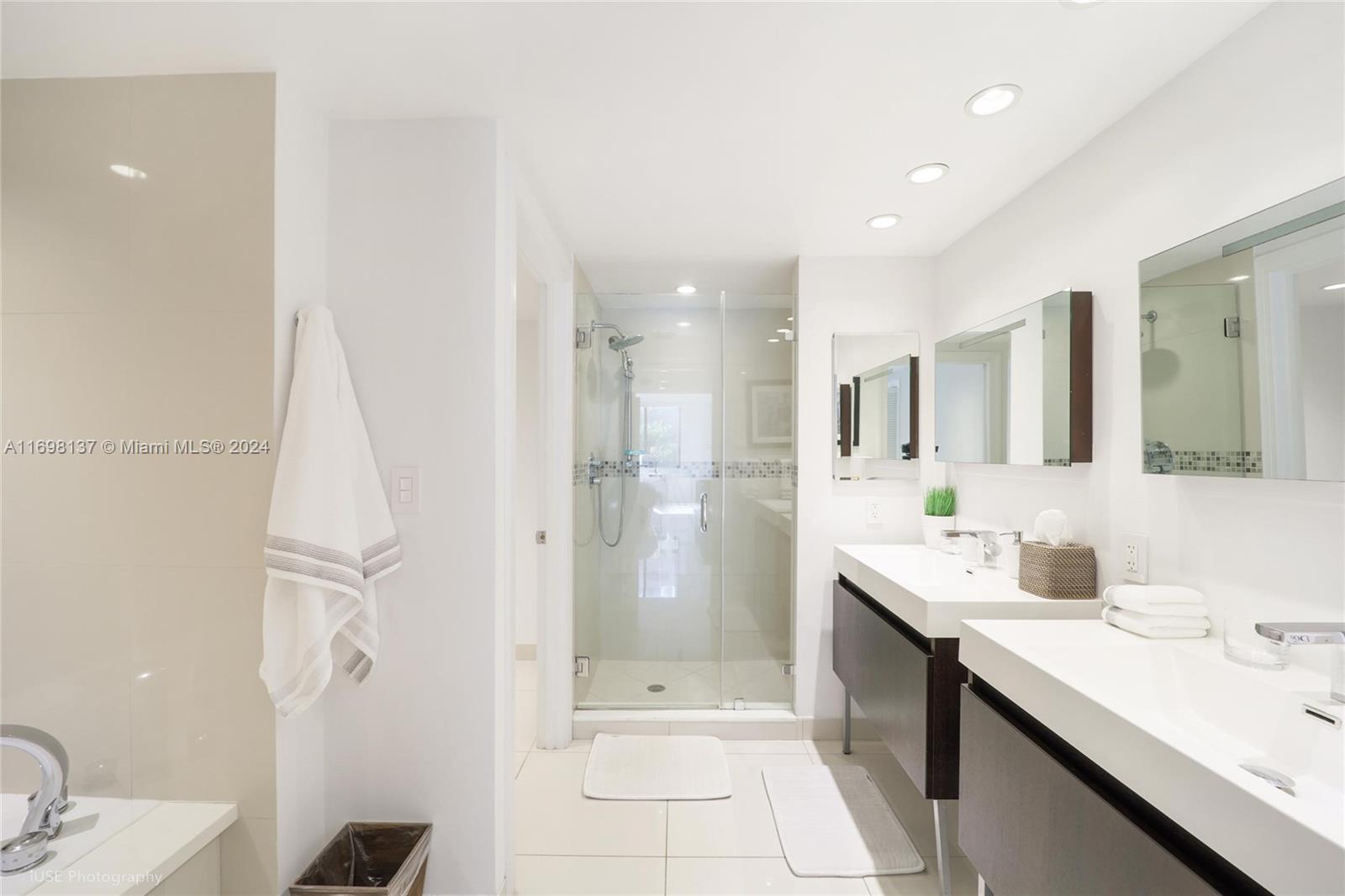 Key Biscayne Key Biscayne, FL 33149 - Photo 7 of 12 a bathroom with a double vanity sink mirror and shower