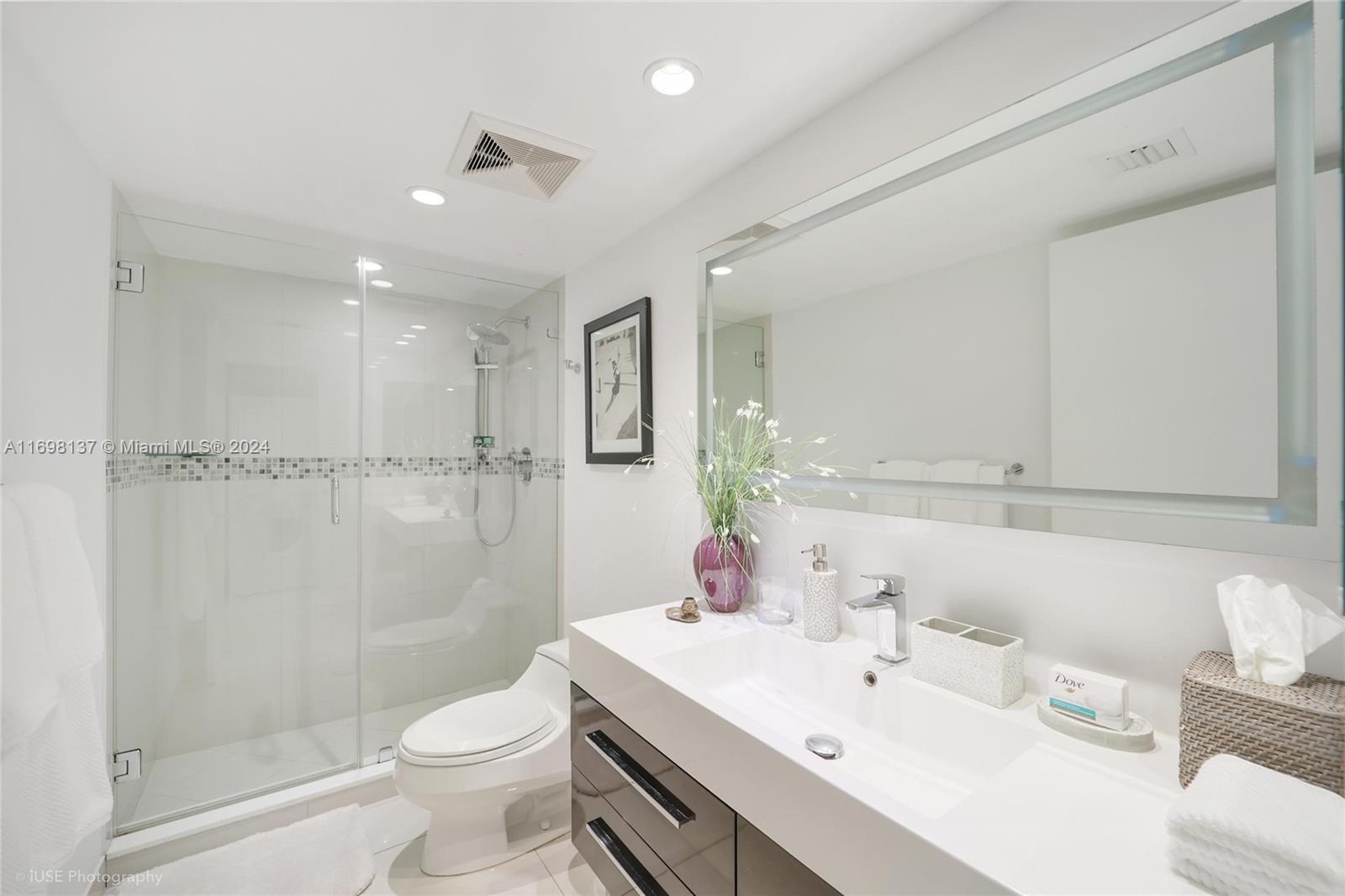 Key Biscayne Key Biscayne, FL 33149 - Photo 9 of 12 a bathroom with a sink toilet and shower