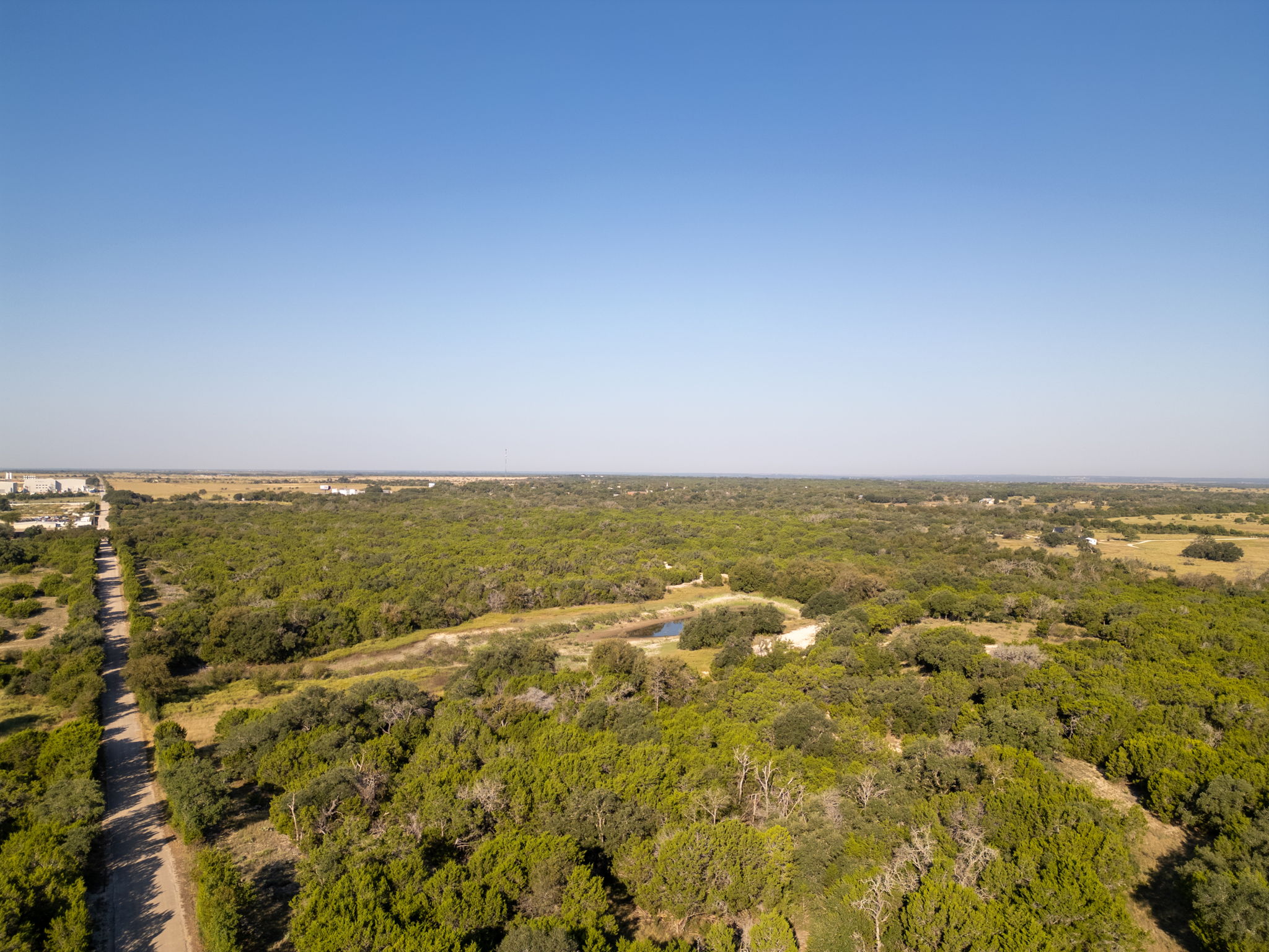 112 Loop 308 Briggs, TX 78608 - Photo 19 of 37 Drone / aerial view of a forest