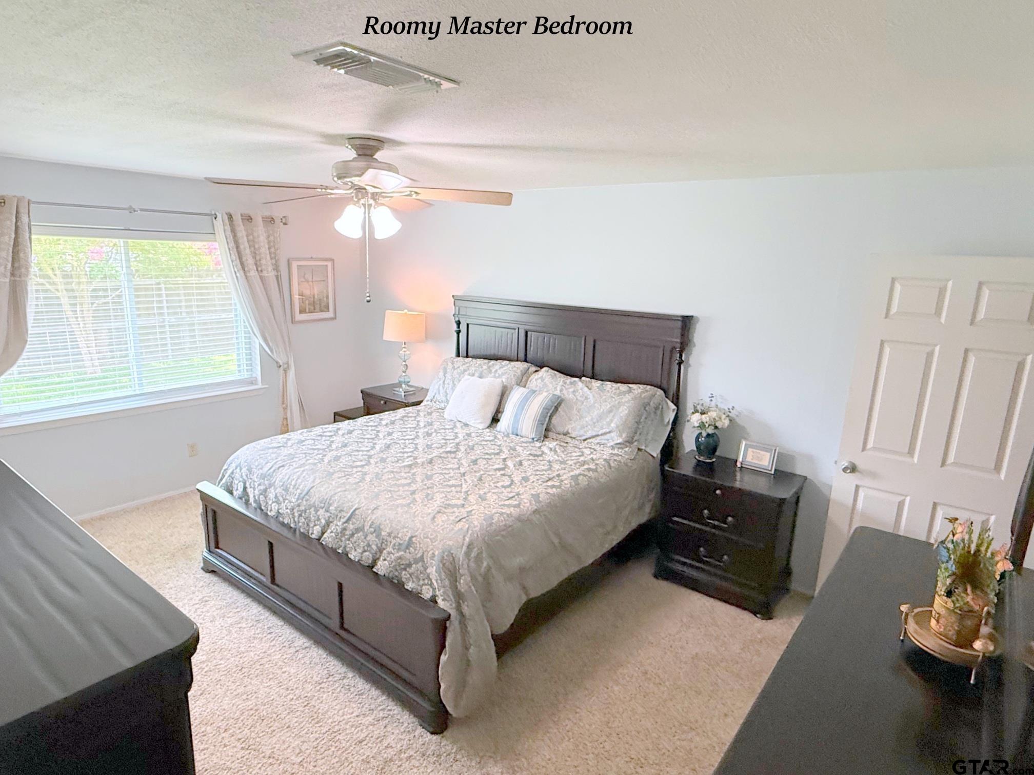 237 Oregon Street Van, TX 75790 - Photo 24 of 44 a bedroom with a bed dresser and a window