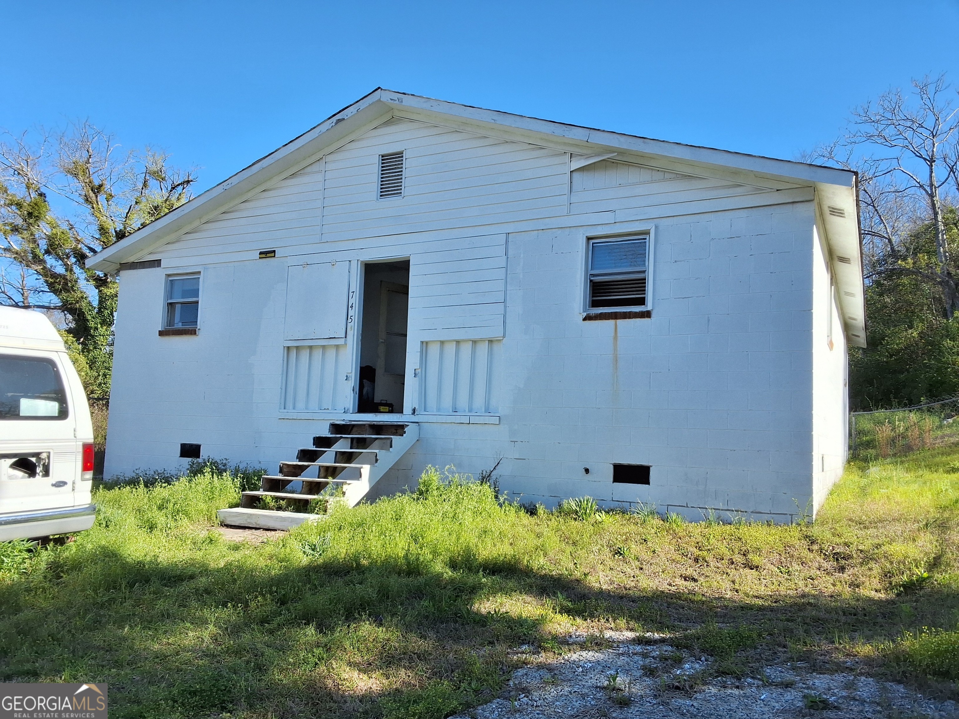 745 Pebble Street Macon, GA 31201 - Photo 1 of 10 a front view of a house with garden