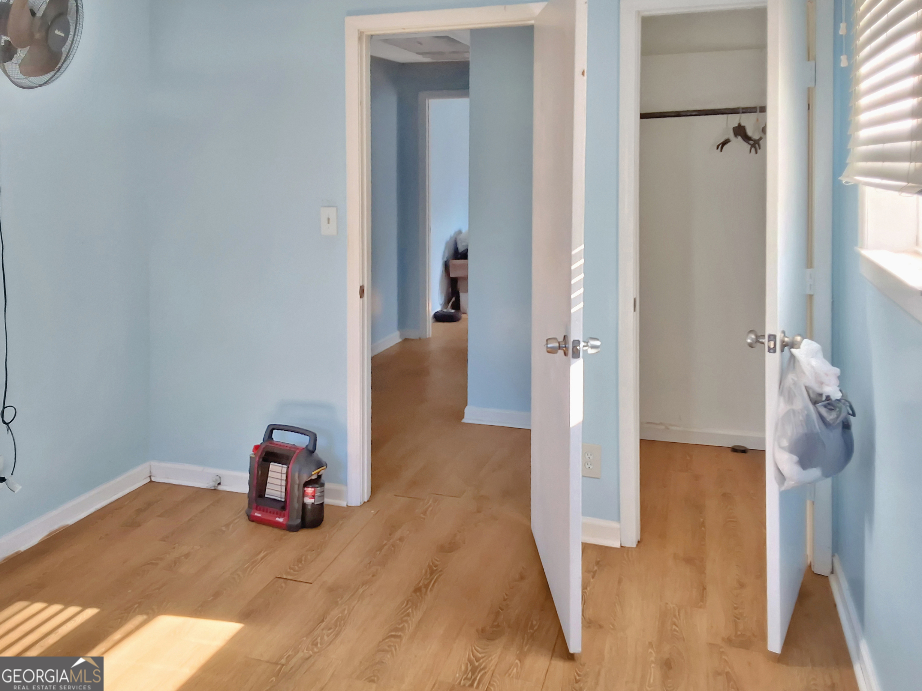 745 Pebble Street Macon, GA 31201 - Photo 7 of 10 a view of a hallway with wooden floor and closet