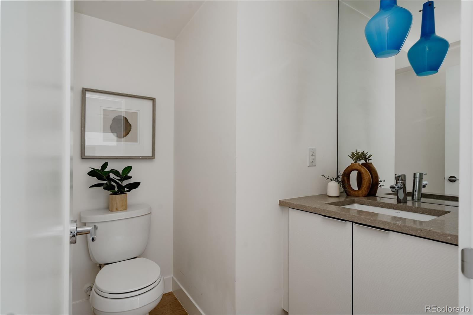 3724 Quivas Street Denver, CO 80211 - Photo 14 of 46 a bathroom with a toilet and a sink