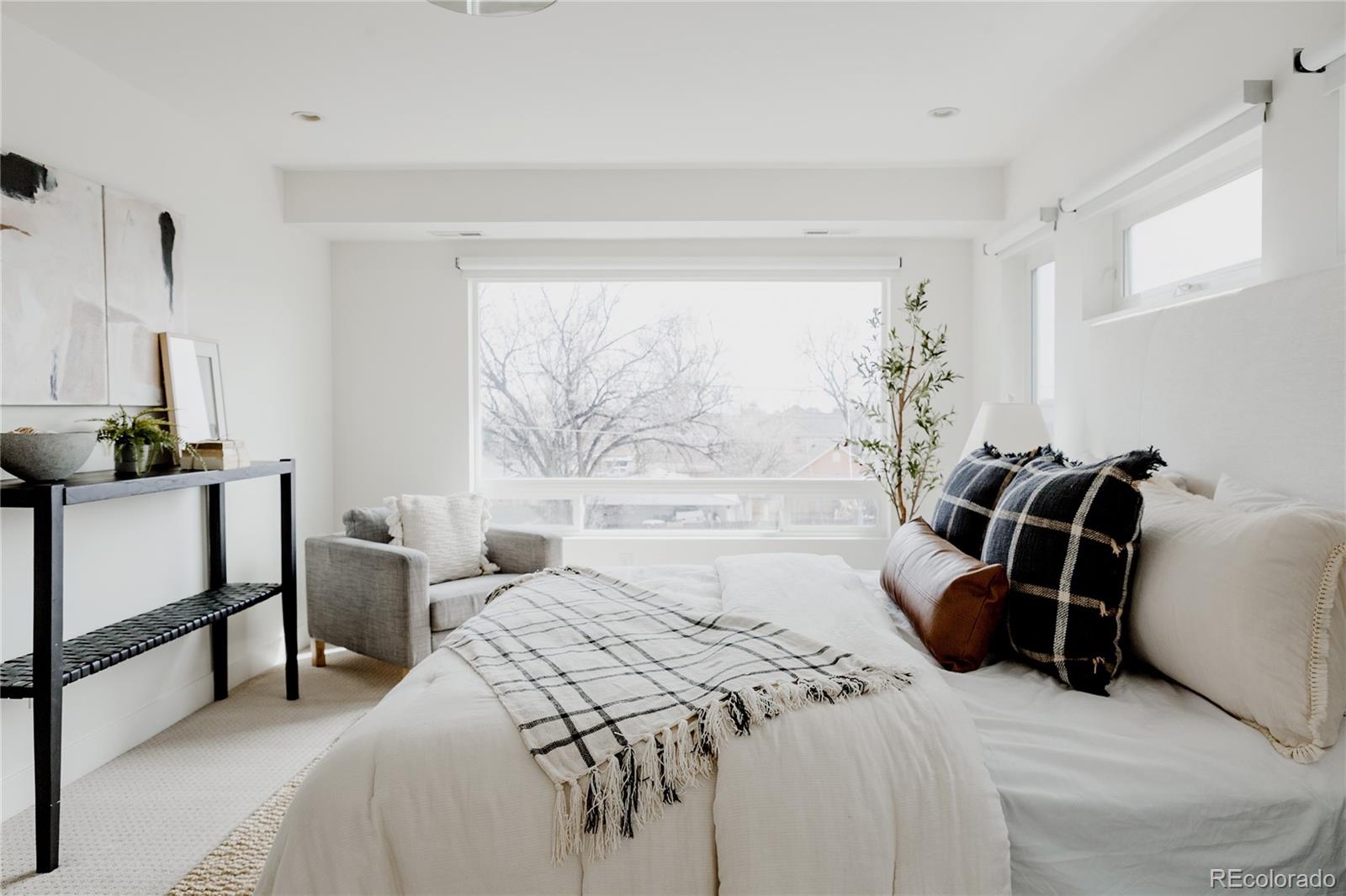 3724 Quivas Street Denver, CO 80211 - Photo 15 of 46 a bedroom with a bed and a window