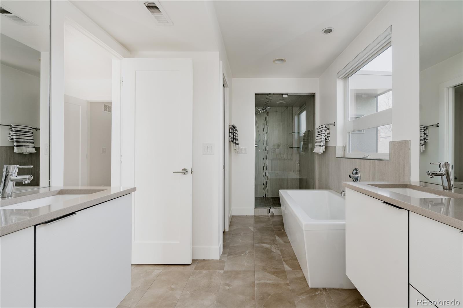 3724 Quivas Street Denver, CO 80211 - Photo 18 of 46 a bathroom with a sink a toilet and shower