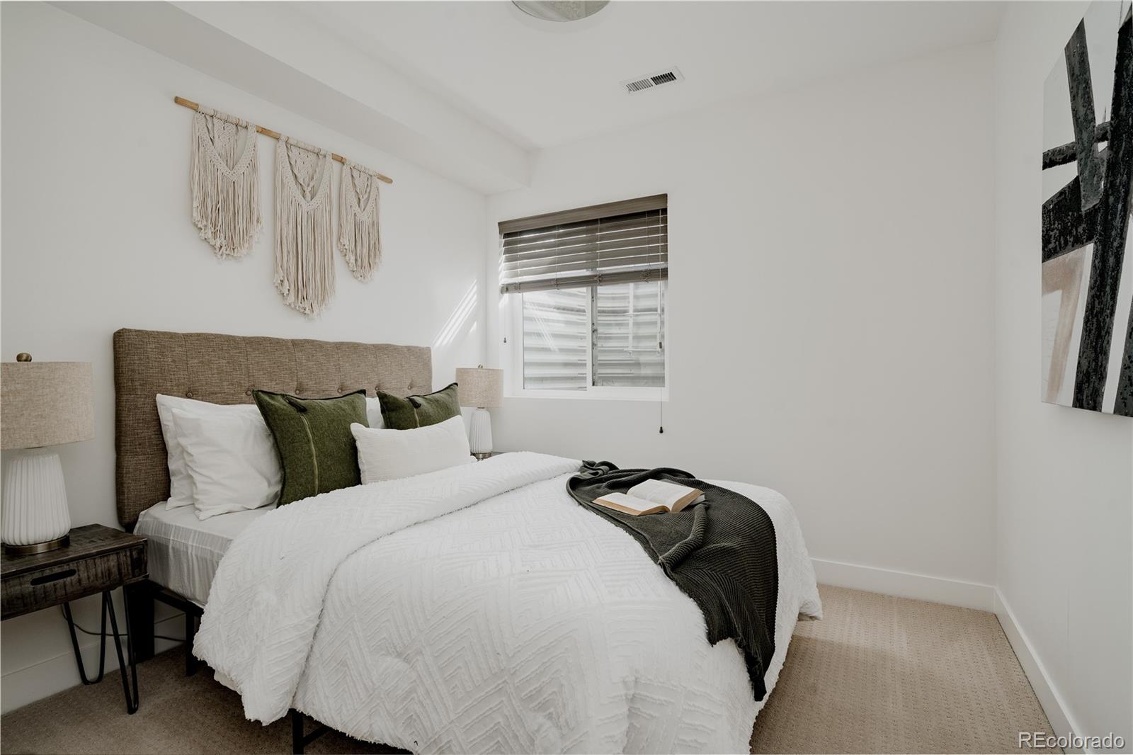 3724 Quivas Street Denver, CO 80211 - Photo 31 of 46 a bed room with a bed and a night stand