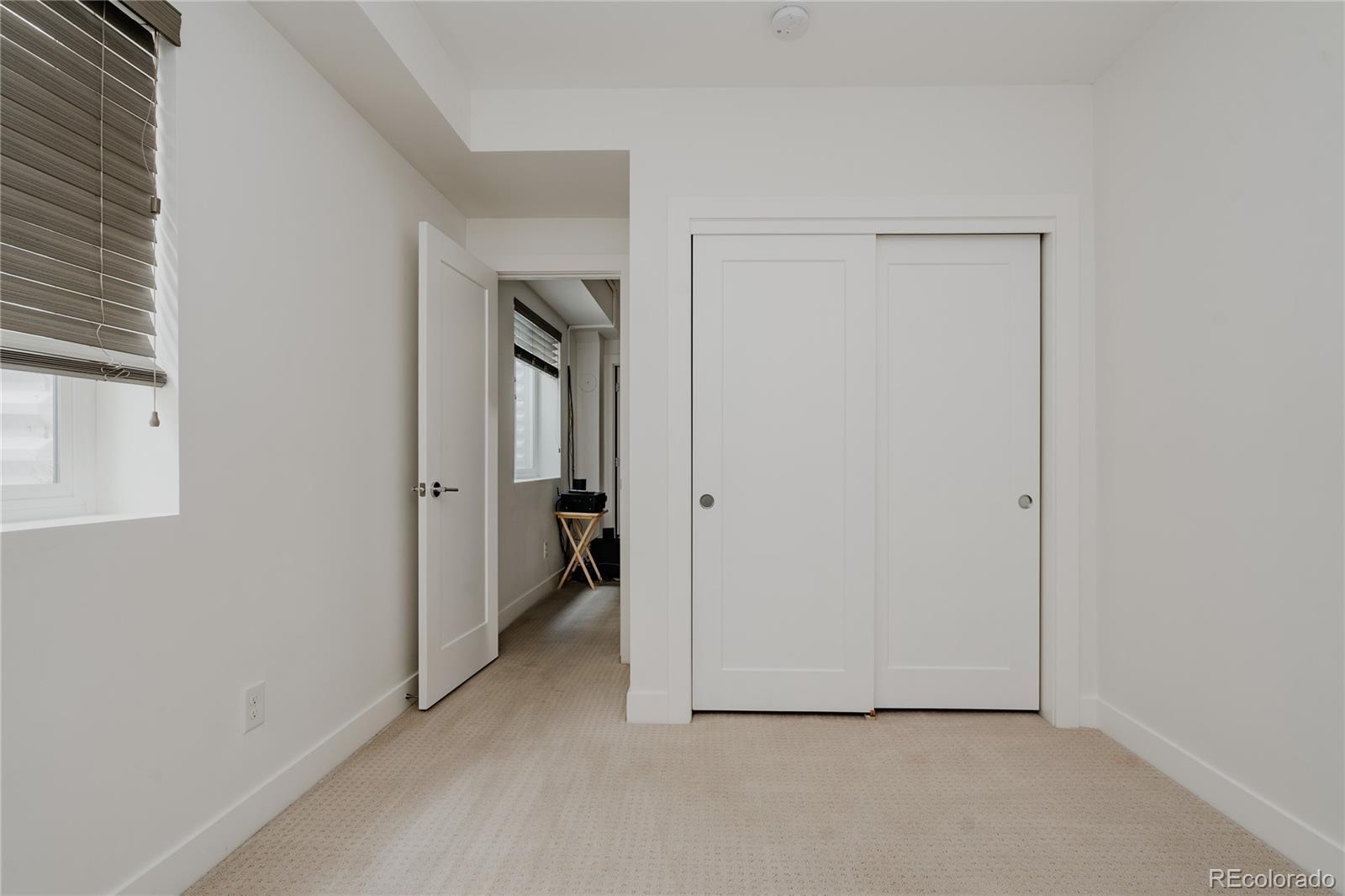3724 Quivas Street Denver, CO 80211 - Photo 33 of 46 a view of a room with a hallway