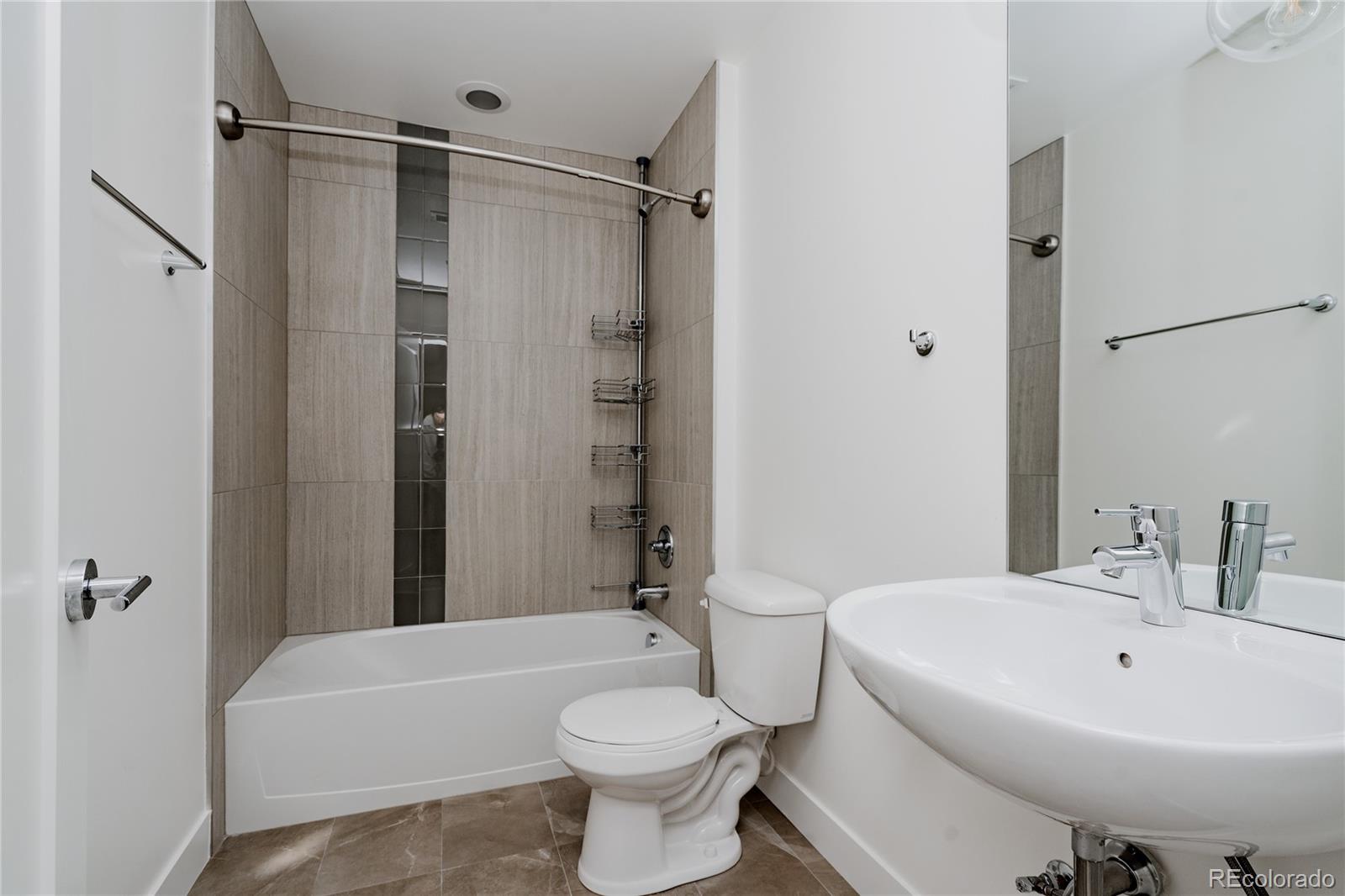 3724 Quivas Street Denver, CO 80211 - Photo 34 of 46 a bathroom with a sink toilet and shower