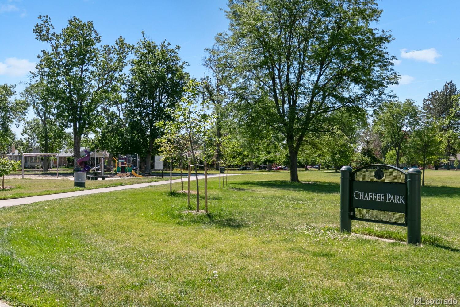 3724 Quivas Street Denver, CO 80211 - Photo 45 of 46 a view of a park with swings and a trees