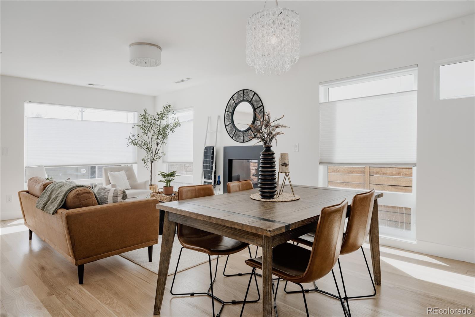 3724 Quivas Street Denver, CO 80211 - Photo 10 of 46 a dining room with furniture and wooden floor