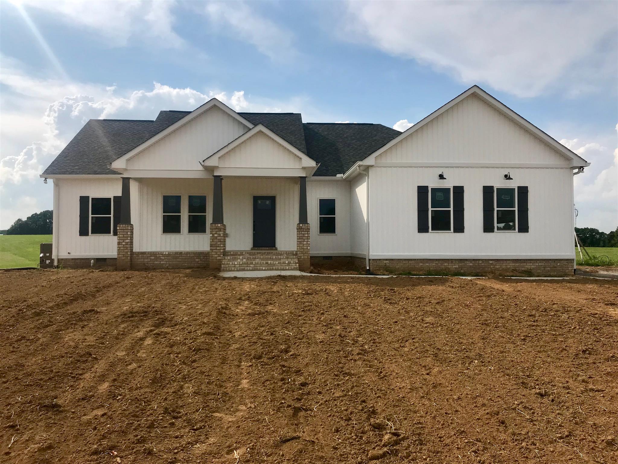 a front view of a house with yard