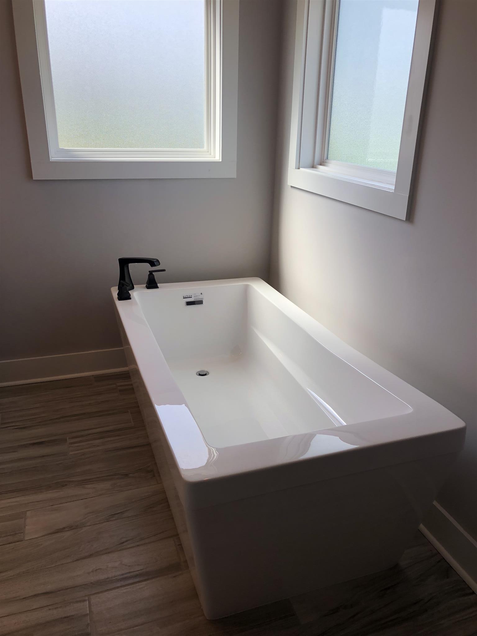 409 Halltown Road Cottontown, TN 37048 - Photo 12 of 25 a white bath tub sitting next to a window