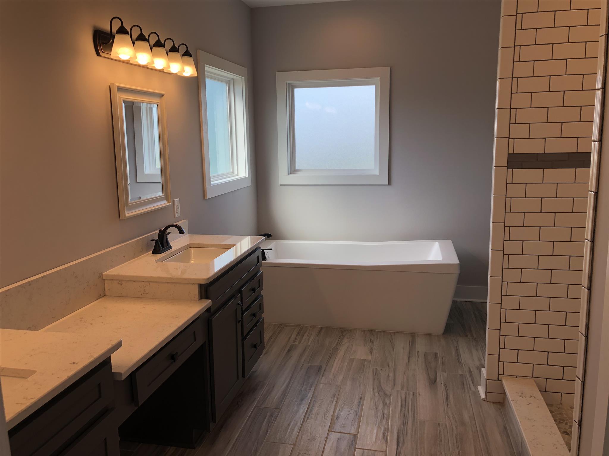 409 Halltown Road Cottontown, TN 37048 - Photo 19 of 25 a view of bathroom with a sink and mirror