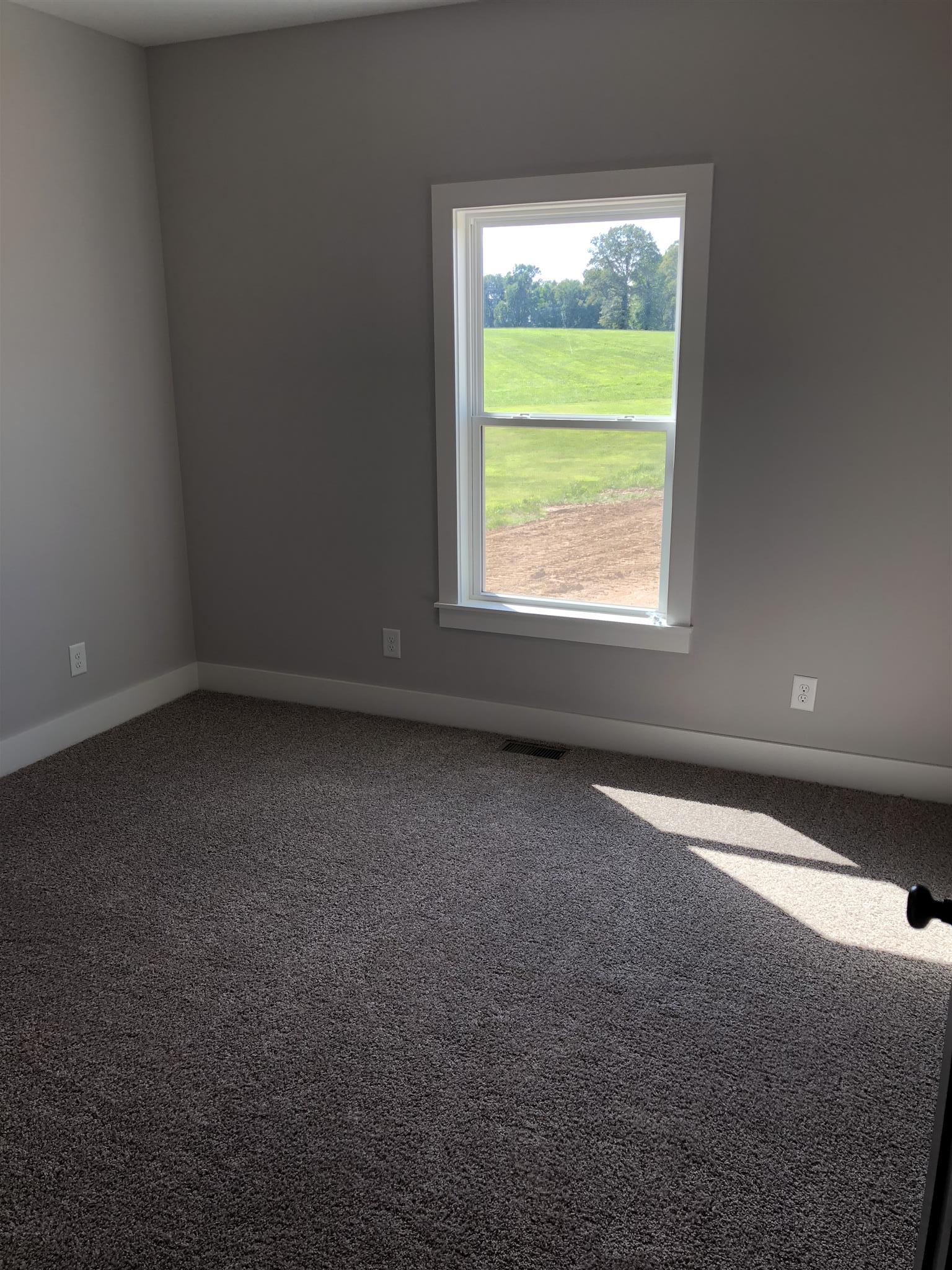 409 Halltown Road Cottontown, TN 37048 - Photo 6 of 25 an empty room with a window