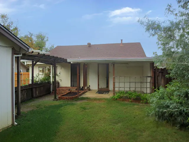 a front view of a house with a garden and porch