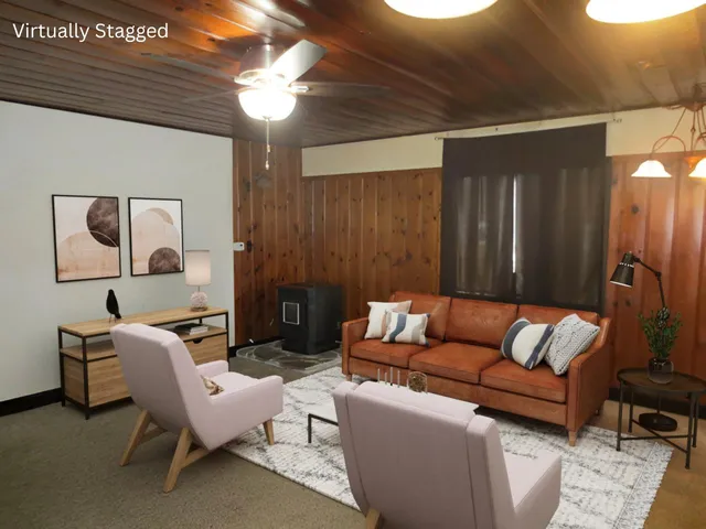 a living room with furniture and a lamp