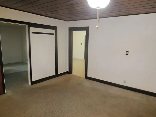 a view of a room with a ceiling fan