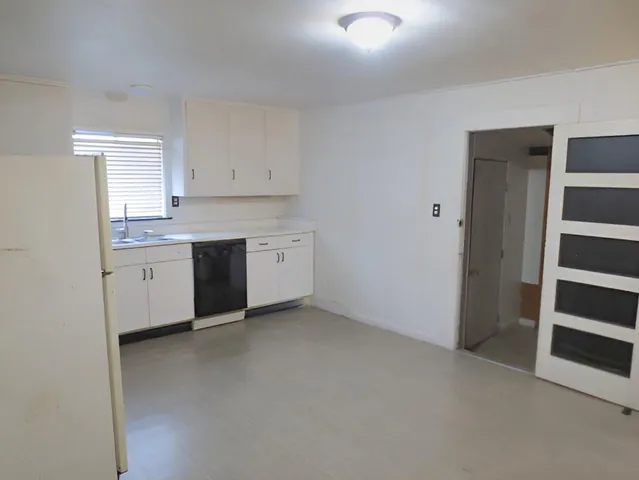 a view of an empty room with a sink