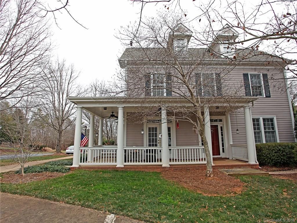 9399 Founders Street, Unit 164 Fort Mill, SC 29708 - Photo 2 of 36 a view of a brick house with a yard and large trees