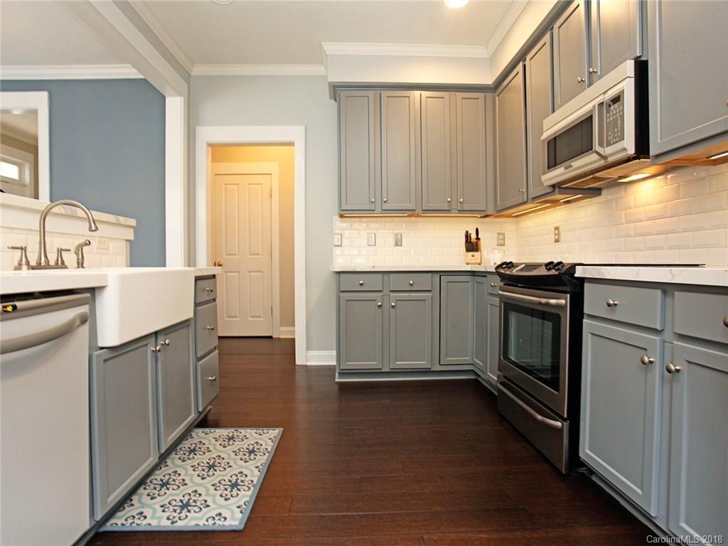 9399 Founders Street, Unit 164 Fort Mill, SC 29708 - Photo 12 of 36 a kitchen with stainless steel appliances granite countertop a sink stove and refrigerator