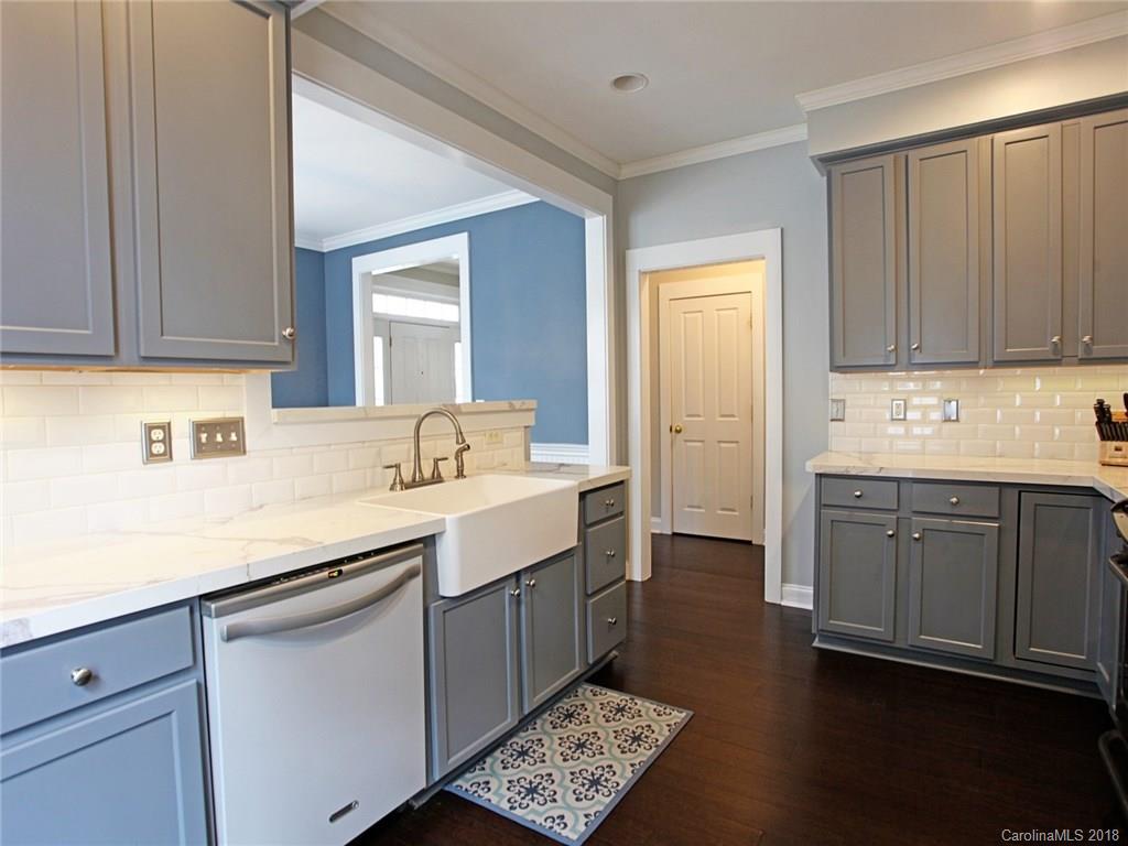 9399 Founders Street, Unit 164 Fort Mill, SC 29708 - Photo 14 of 36 a kitchen with sink cabinets and stove